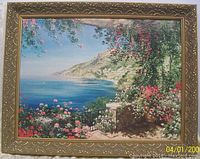 Full view of framed canvas print depicting coastal landscape and ornate gold-tone frame