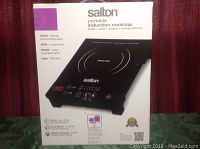 Front view of the Salton portable induction cooktop box showing image of the cooktop and main features like power 1800 watts, faster than gas or ceramic stoves, no open flames, and instant temperature control.