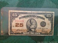 Front side of the banknote showing denomination, engraving, date and serial number