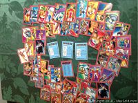 Overview photo displaying the full collection of 50 Youngblood comic cards spread out on a surface showing colorful character illustrations and card backs.