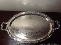 Full view of the silver plate oval tray showing the grapevine pattern engraving and overall shape with handles.