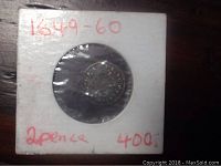 Silver 2 pence coin from 1649-60 mounted in white cardboard holder with red writing showing the date range and denomination plus value notation.