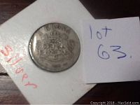 Close-up photo of the 1898 1 Krona silver coin with crowned coat of arms and denomination visible.