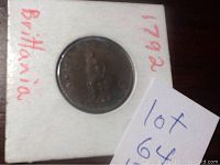 Front side of the coin showing the profile of George III with handwritten notes on the holder.