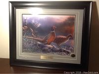 Full view of framed print showing ring neck pheasants in evening meadow with plaque and gold seal.