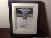 Framed photo of Eric Lindros in St. Michaels College hockey uniform, signed by Eric Lindros.
