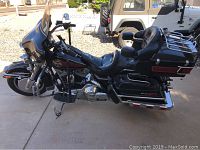 Right side full view of motorcycle showing fairing, seats, saddlebags and top trunk