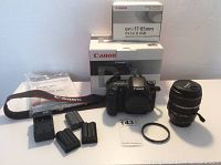 Overview of camera body, EF-S 17-85mm lens in box, charger, four batteries, strap, manuals and Quantaray filter