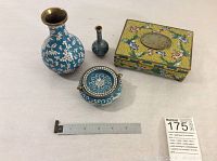 Four enameled brass oriental decor items: three vases and one rectangular box with lid, placed together with a ruler for scale.