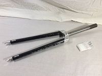 Overall view of the carbon fiber bicycle fork showing the black carbon fiber blades with Wound Up branding and steel steerer tube.