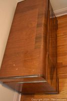 Angled front view showing top surface with wear and the front design features.