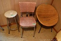 Photo of three mid-century chairs: wicker metal frame chair, vinyl chrome kitchen chair, and vinyl chrome stool