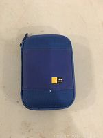 Closed view of the blue Case Logic carrying case with logo visible.