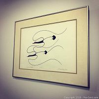 Framed artwork featuring three stylized black birds with red beaks, titled 'Majesty of Flight.'