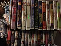Top view of VHS collection with visible Disney titles including The Jungle Book, Lion King II, Pocahontas, and others.