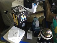 Photo showing boxed Miami Marlins baseball bobblehead and other desk items