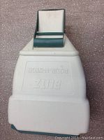 Top view showing embossed branding and handle on lid.