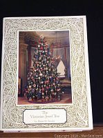Front cover of the book showing a Victorian decorated tree with ornate gold border design
