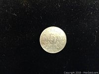 1936 Canadian 5 cent nickel coin front view on black background