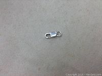 Photo of the .925 sterling silver lobster clasp on a neutral background.