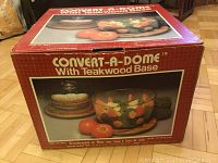 Box of Convert-A-Dome with Teakwood Base showing product image and branding.