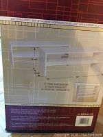 Photo of boxed Vaughan Wood 24 inch storage stacker with product image and measurements on the box.