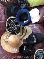 Photo of nine assorted ladies hats including straw hats, rabbit hair mix hat from Merida, Adidas cap, and other styles.