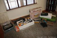 Overview of multiple train boxes, blister packs, track sections and signal lights on floor