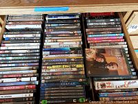 Drawer with DVDs including Star Wars, Elizabeth, Gladiator, and others