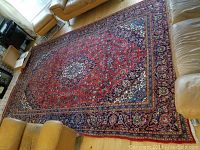 Wide shot of entire rug in living room setting showing overall design and condition