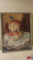 Oil on canvas clown painting with a clown's portrait, signed 'Tapia' in the corner.