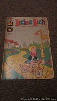 Richie Rich comic book with Richie Rich on scooter cover