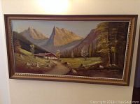 Full view of framed oil painting showing mountain landscape with chalet