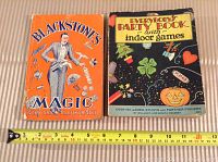 Photo showing the front covers of two vintage books, Blackstone's Magic Tricks with orange cover and Everybody's Party Book with colorful cover including images of party items and symbols.