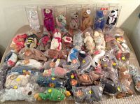 Full collection of 41 assorted Ty Beanie Baby bears, animals, and birds displayed on a table, some in protective bags and cases.