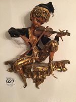 Front view of the jester playing violin wall sculpture