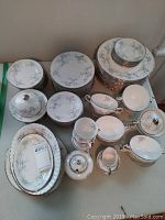 Photo showing the entire Paragon China dinnerware set arranged grouped by item type.