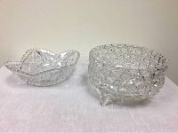 Two antique crystal cut glass bowls on white surface showing entire lot