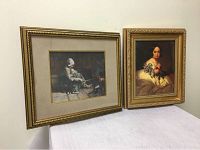 View of both framed prints displayed side by side on a table showing overall size, frame detail and image content.