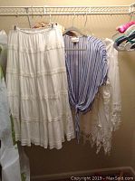 White tiered maxi skirt or dress with embroidery and blue and white striped blouse with front tie, sheer white lace garment