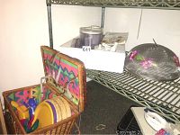 Braun food processor with cookbook on metal shelf