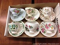 Overview of six bone china tea cups with matching saucers, each featuring different floral patterns.