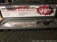 Closed case showing the Professional Santoku Kitchen Knife in original packaging and box with information on features and MSRP.