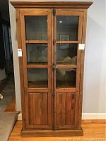 Front view of cabinet with closed glass doors