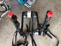 Full view of the Allen Sports bike rack showing frame, straps, and padded holders.