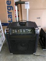 Front view of the Ion Block Rocker sound system showing the speaker grille and top control panel.