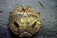 Front view of badge showing eagle wings, Inspector General text, Dick Tracy banner, and Secret Service Patrol text