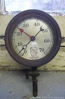 Front view of the vintage Ashcroft altitude pressure gauge showing dial and needles with visible wear on the metal casing.
