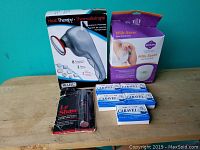 Photo of personal care lot including Wahl Heat Therapy Massager, Milk-Saver breastfeeding kit, 5 bars of Caravelle natural soap, and Le Shave travel razor.