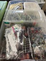 Overview of bead storage containers filled with various beads and kits.